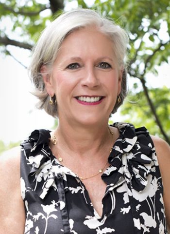 A Woman Smiling For The Camera